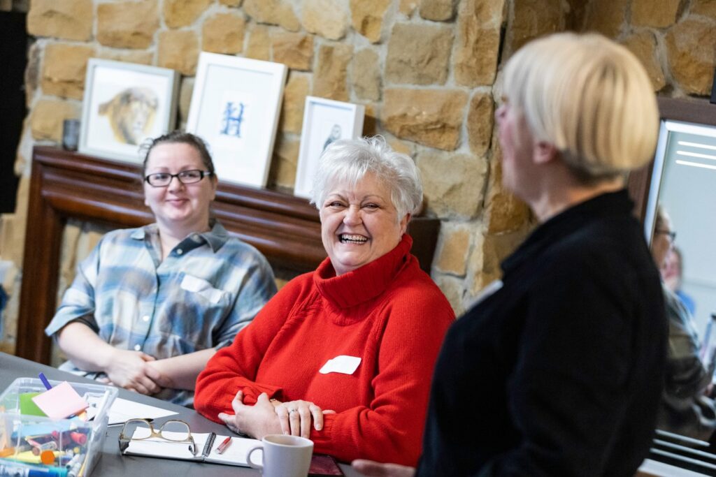 Image of some women talking at a table